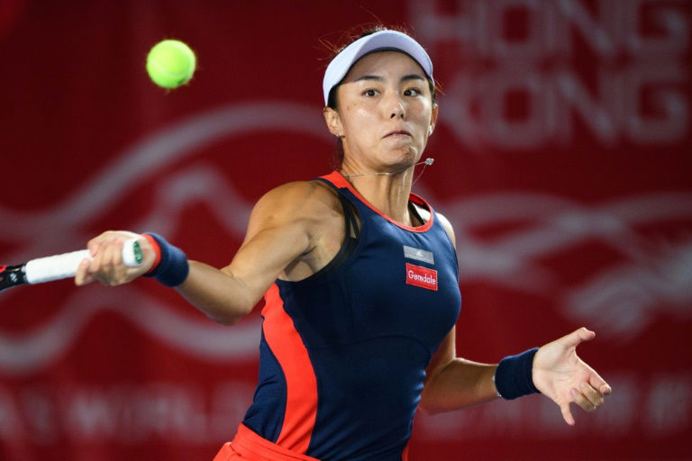 Wang on brink of year's biggest win as rain stops play