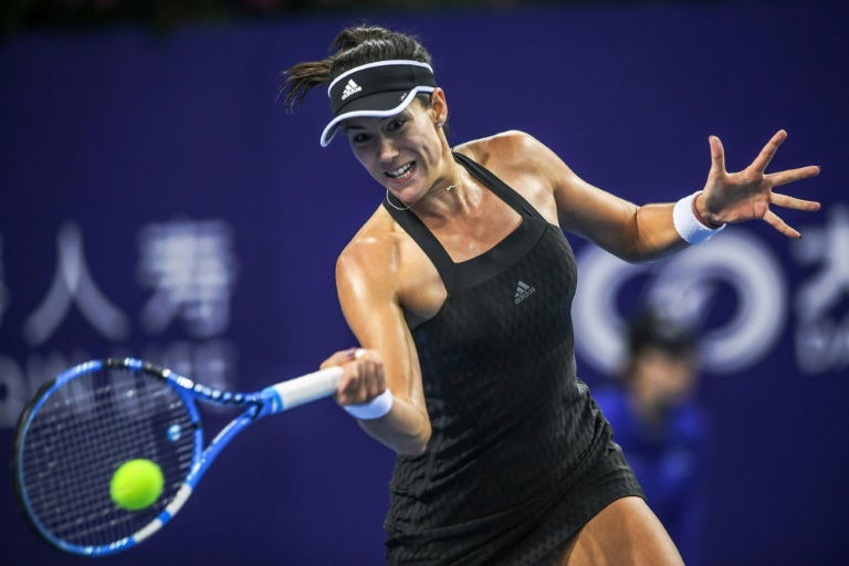 Muguruza through to Zhuhai semis after tense decider